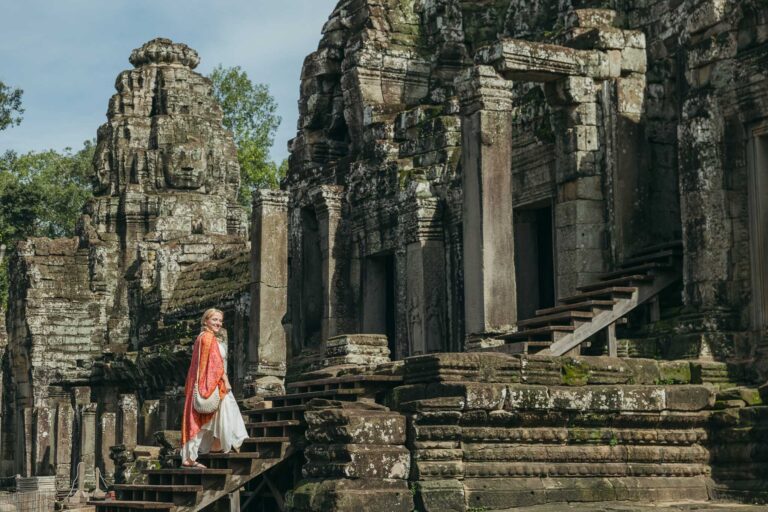 Traveler at bayon temple, Angkor. Photograph by Angkor Wat Photographer