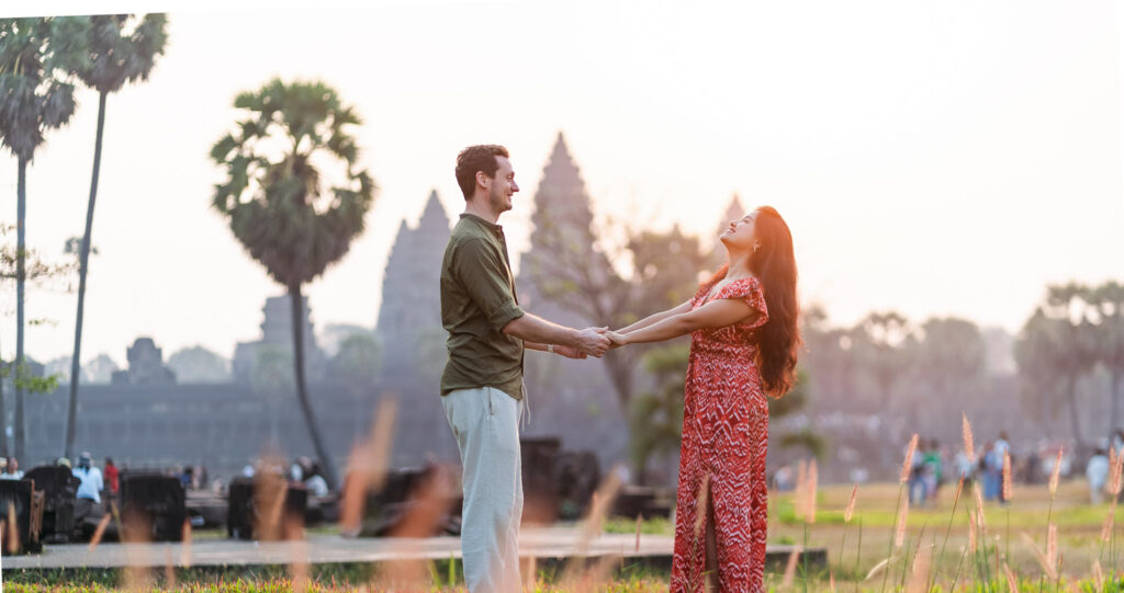 Couple walking together during Angkor Wat sunrise photoshoot in Siem Reap